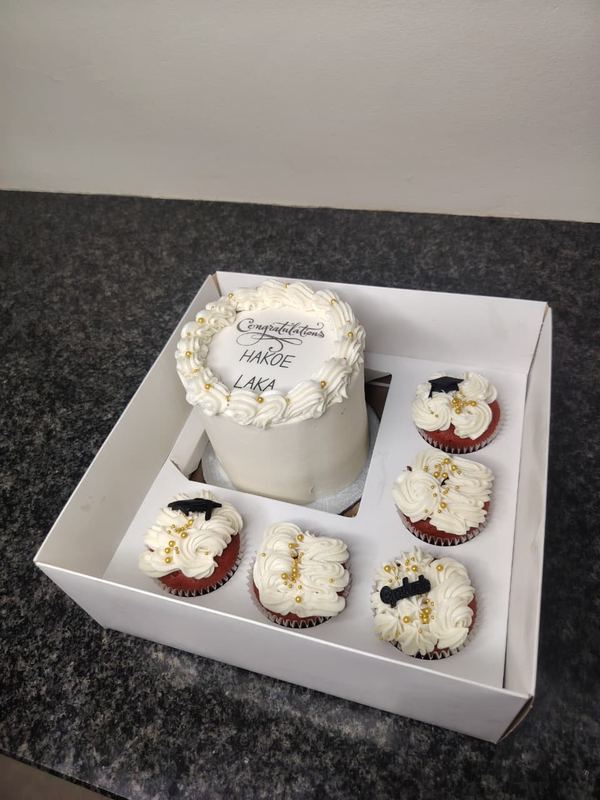 Congratulations bento cake with white and red velvet cupcakes in a gift box