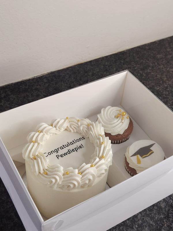 Congratulations bento cake with graduation cupcakes in a gift box