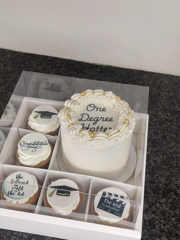 One Degree Hotter graduation bento cake with themed cupcakes in a clear gift box