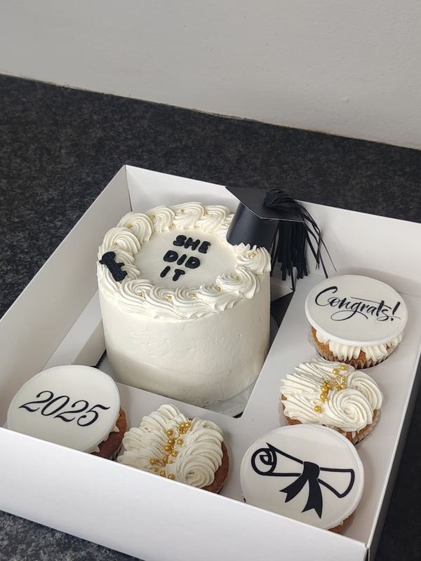 She Did It graduation bento cake with 2025 and congratulations cupcakes