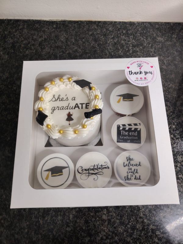 She's a graduATE bento cake with printed graduation cupcakes in a gift box