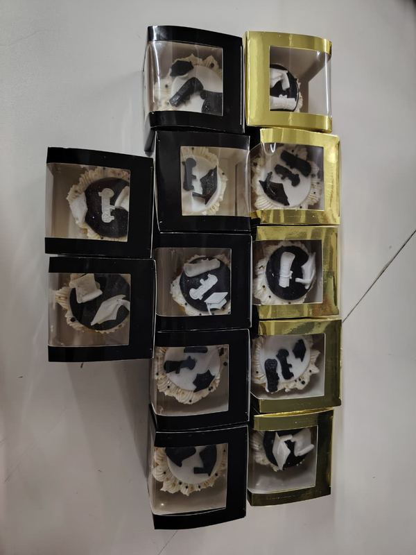 Stacked individual cupcake gift boxes in black and gold