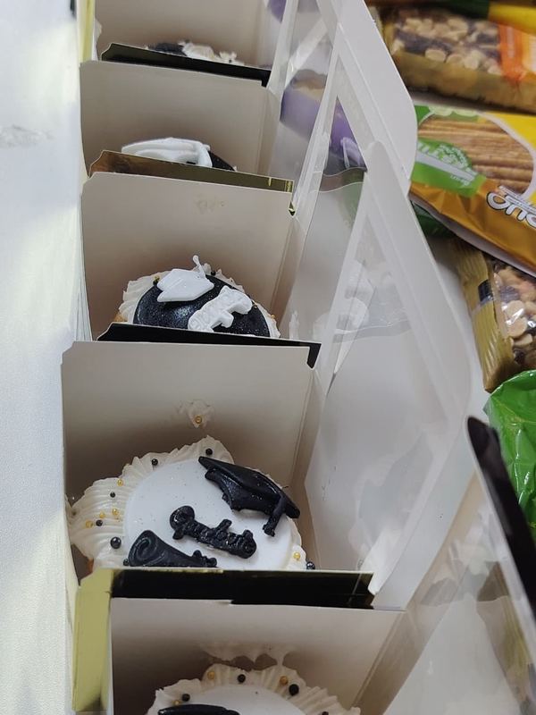 Individually boxed graduation cupcakes