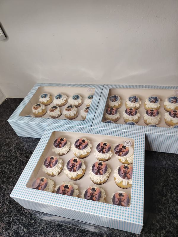 Three boxes of cupcakes with printed photo toppers
